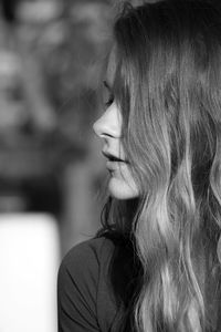 Close-up of young woman with long hair