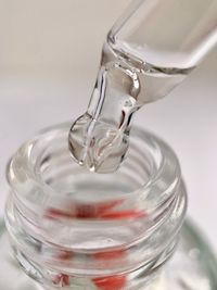Close-up of glass pouring water
