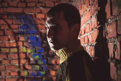 Portrait of man against wall