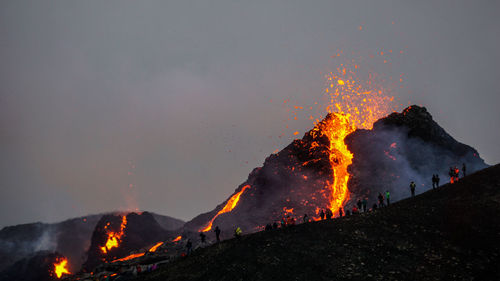 People watch an eruption in mt fagradalsfjall, southwest iceland, only 30 km away from reykjavik.