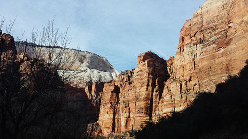 Low angle view of rock formation against sky