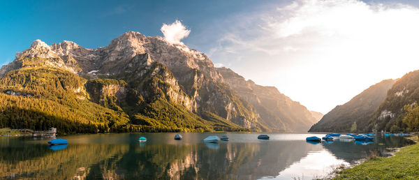 Scenic view of lake and mountains against sky