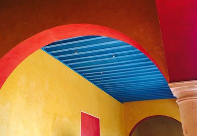 Low angle view of blue ceiling in building