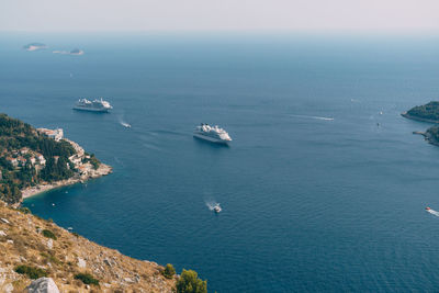 High angle view of sailboat sailing on sea against sky