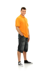 Portrait of young man standing against white background