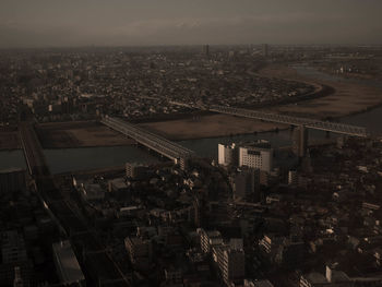 Aerial view of cityscape against sky