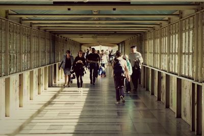 People walking in corridor