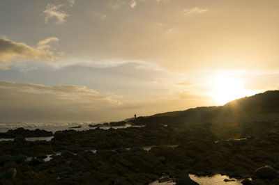 Scenic view of landscape against sky during sunset
