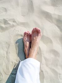 Low section of man on sand