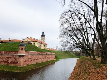 View of buildings at riverbank