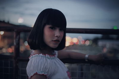 Portrait of woman standing against sky during sunset