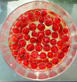 High angle view of strawberries in glass bowl on table