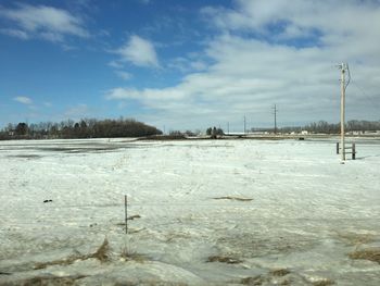 Scenic view of frozen lake against sky