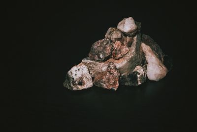 Close-up of rock against black background