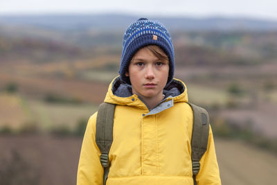 Portrait of teenage girl standing in snow