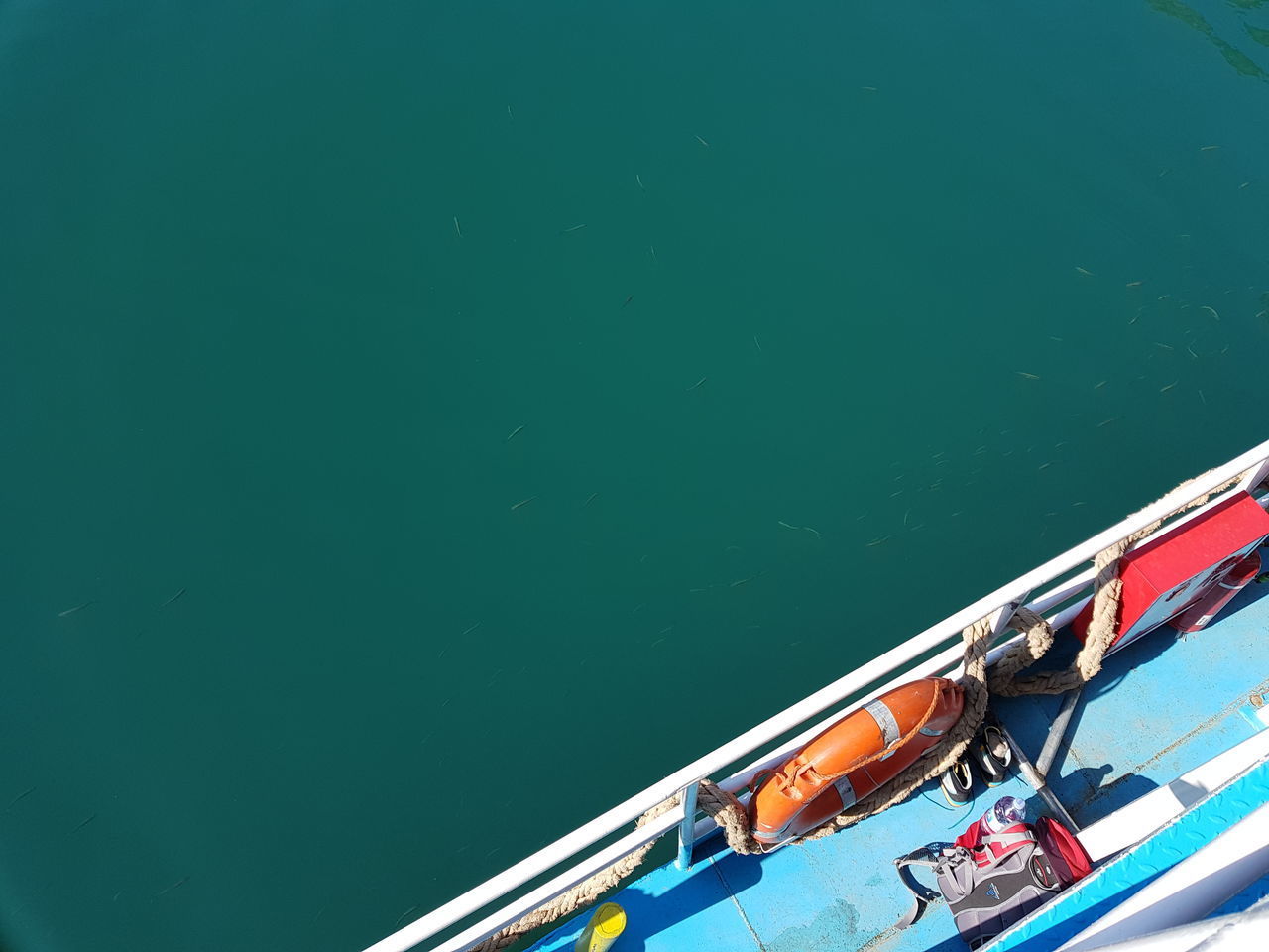 HIGH ANGLE VIEW OF RED SHIP MOORED ON SEA