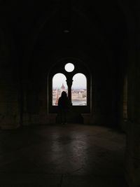 Woman walking in corridor