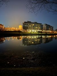 Illuminated buildings in city at night