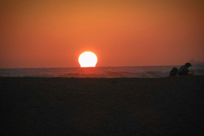 Scenic view of sea at sunset