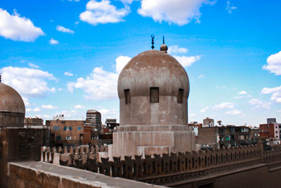 Buildings in city against sky