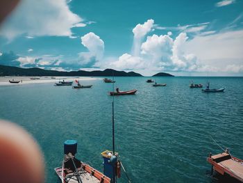 View of boats in sea against sky