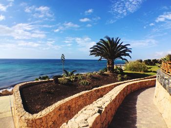 Scenic view of sea against cloudy sky