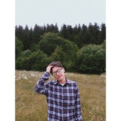 Full length of man standing by plants