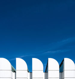 High section of building against clear blue sky