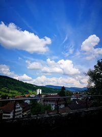 Scenic view of town against sky