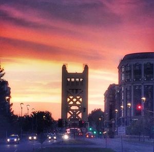 Traffic on road at sunset
