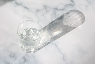 High angle view of glass on snow