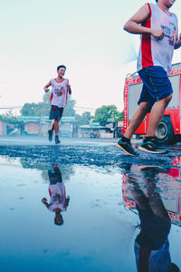 Full length of people enjoying in water