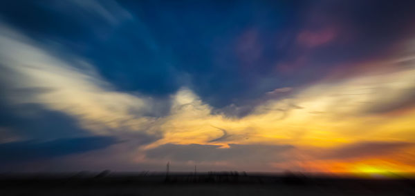 Low angle view of cloudy sky during sunset