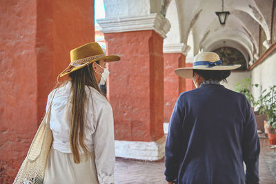 Tourists with a guide in inside the santa catalina monastery, arequipa, peru. exploring unesco