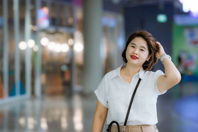 Portrait of woman standing outdoors