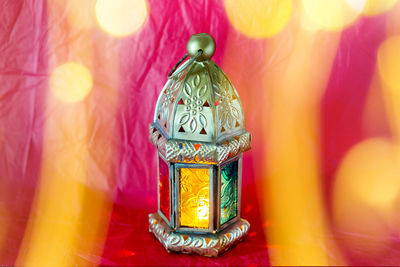 Traditional arabic lantern lit up for celebrating holy month of ramadan with bokeh lights