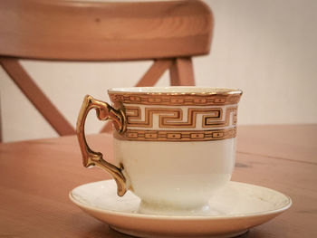 Close-up of coffee cup on table