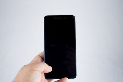 Close-up of hand holding smart phone