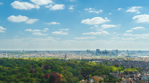 Panoramic view of sea and cityscape against sky