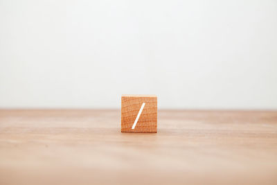 Close-up of toy blocks on table against white background