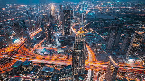 Aerial view of illuminated cityscape at night