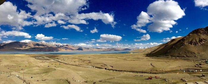 Panoramic view of landscape against cloudy sky