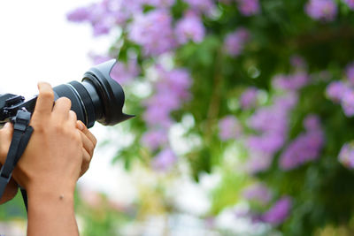 Close-up of hand holding camera