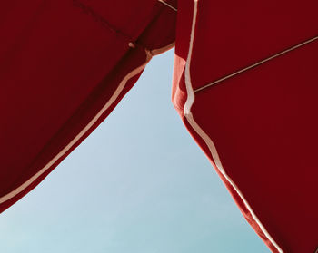 Low angle view of hanging against sky