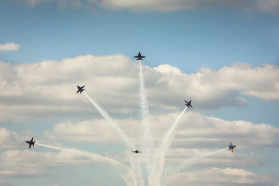 Low angle view of airplane flying in sky