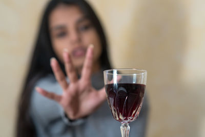 Midsection of woman holding drink