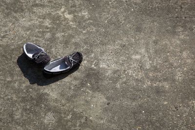 High angle view of shoes on sand