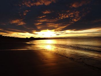 Scenic view of sea against romantic sky at sunset