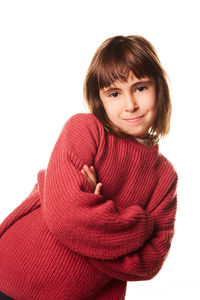 Portrait of young woman standing against white background