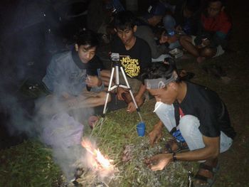 Group of people having food outdoors